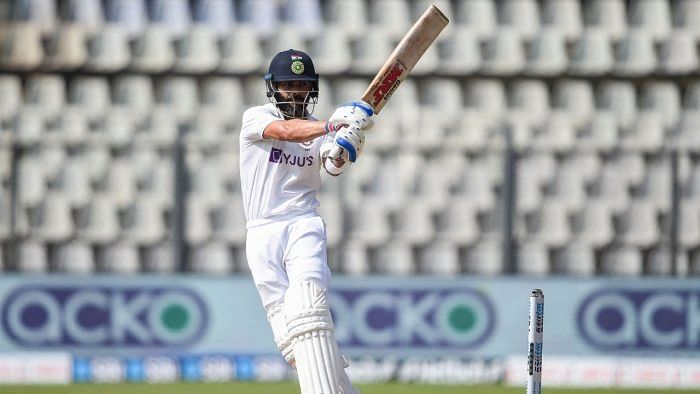 In this file photo taken on December 5, 2021 India's captain Virat Kohli plays a shot during the third day of the second Test cricket match between India and New Zealand at the Wankhede Stadium in Mumbai. Credit: AFP File Photo