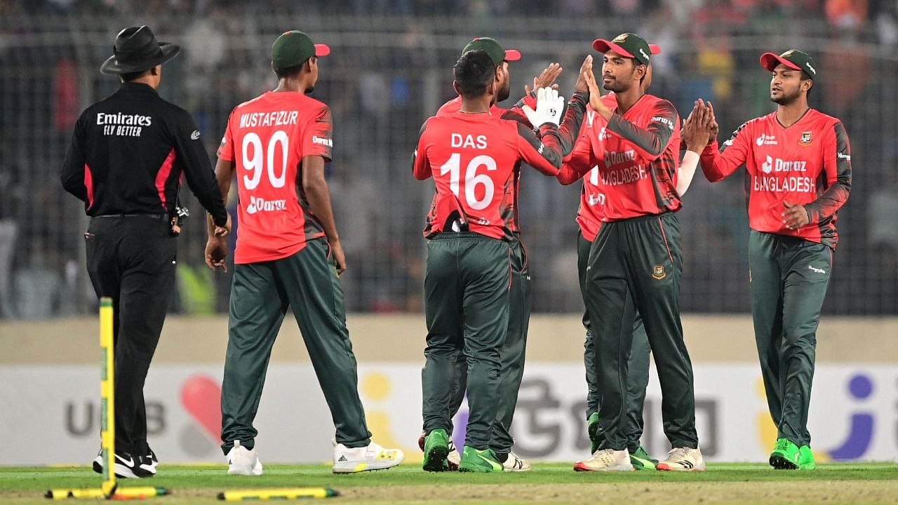 Bangladesh's players celebrate after winning the first T20 international match against Afghanistan at the Sher-e-Bangla National Cricket Stadium in Dhaka. Credit: AFP Photo