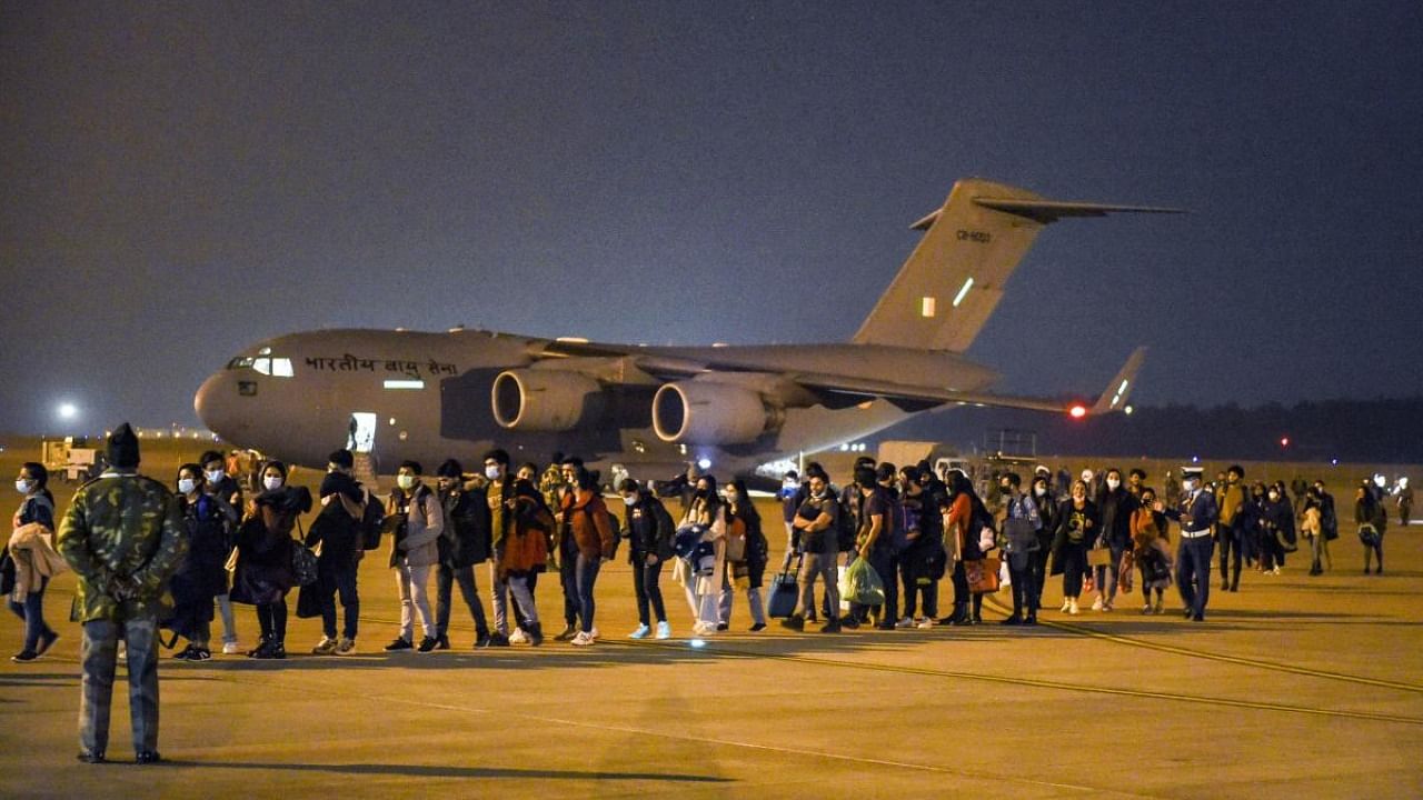 Indian nationals, evacuated from crisis-hit Ukraine, upon their arrival at the Hindon Air Force Station in Ghaziabad. Credit: PTI Photo