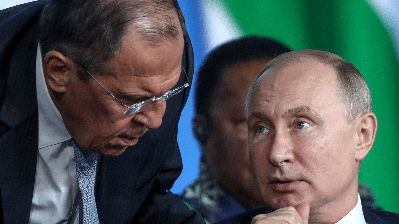 Russian President Vladimir Putin, right, listens to Russian Foreign Minister Sergey Lavrov. Credit: AP Photo