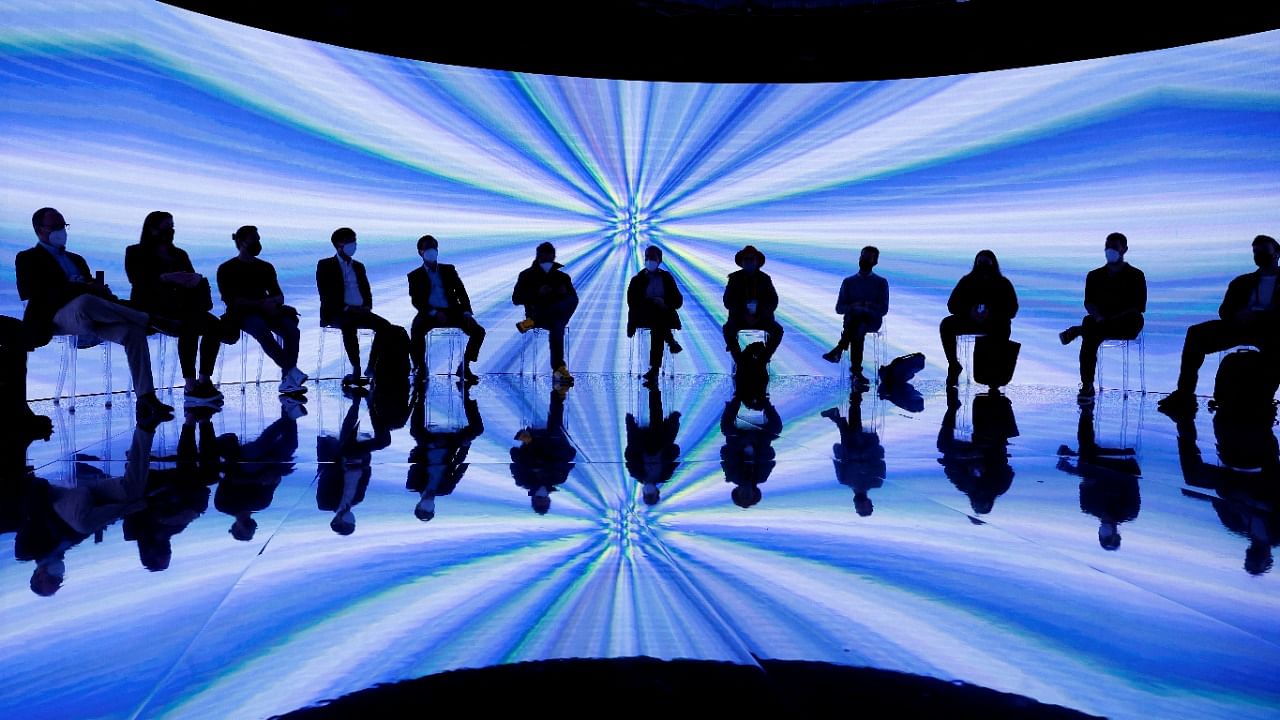 People attend an Immersive 360 holographic show during the GSMA's 2022 Mobile World Congress (MWC), in Barcelona, Spain. Credit: Reuters Photo