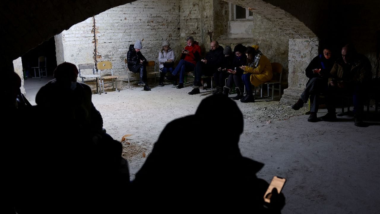 People takle shelter in the basement of a school in Lviv. Credit: Reuters Photo