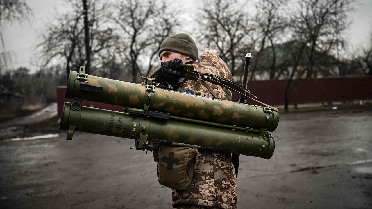 An Ukrainian soldier holds an anti-tank launcher at a frontline, northeast of Kyiv on March 3, 2022.