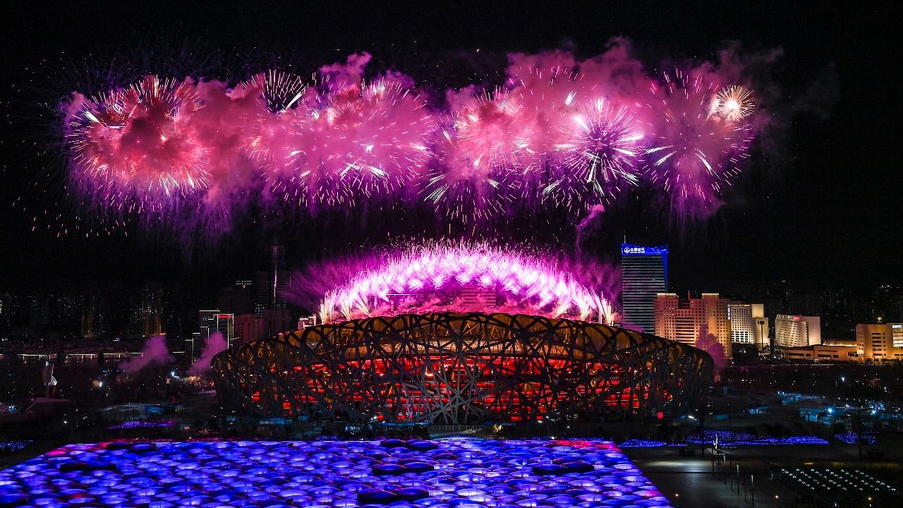 Fireworks burst above the National Stadium during the opening ceremony at the 2022 Winter Paralympics. Credit: AP Photo