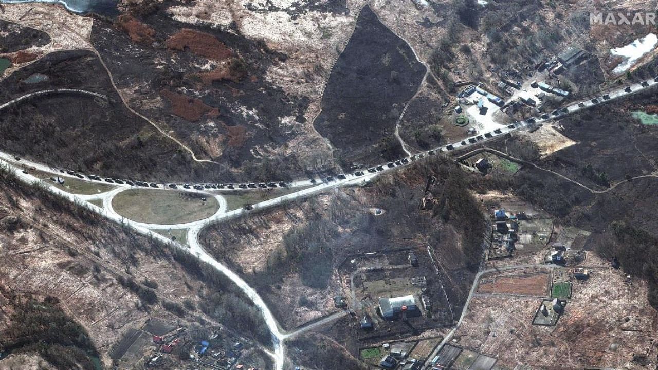 This satellite image provided by Maxar Technologies shows a military convoy near Invankiv, Ukraine. Credit: AP Photo