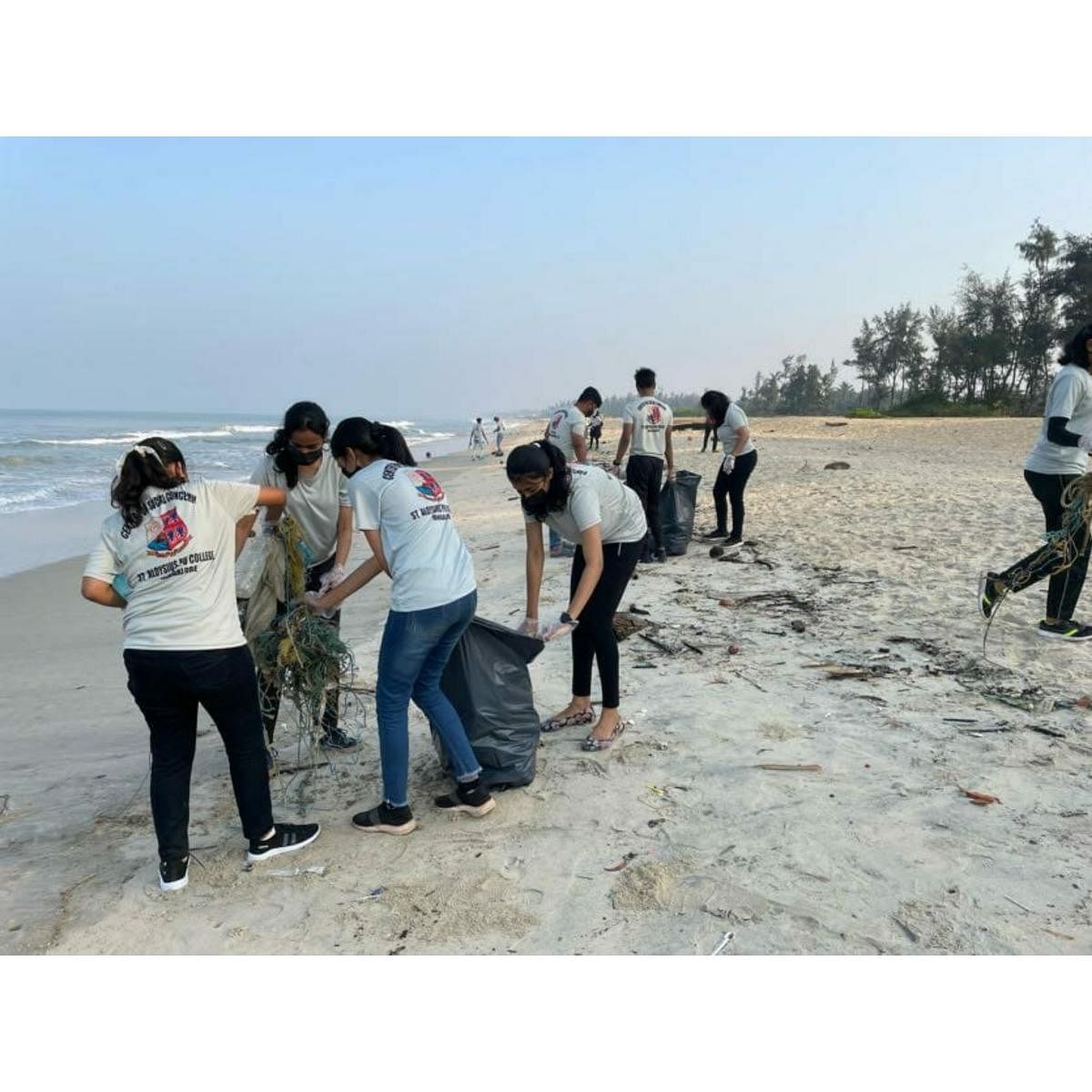 Students carry out a cleanliness drive on the shores of Tannirbhavi Beach.