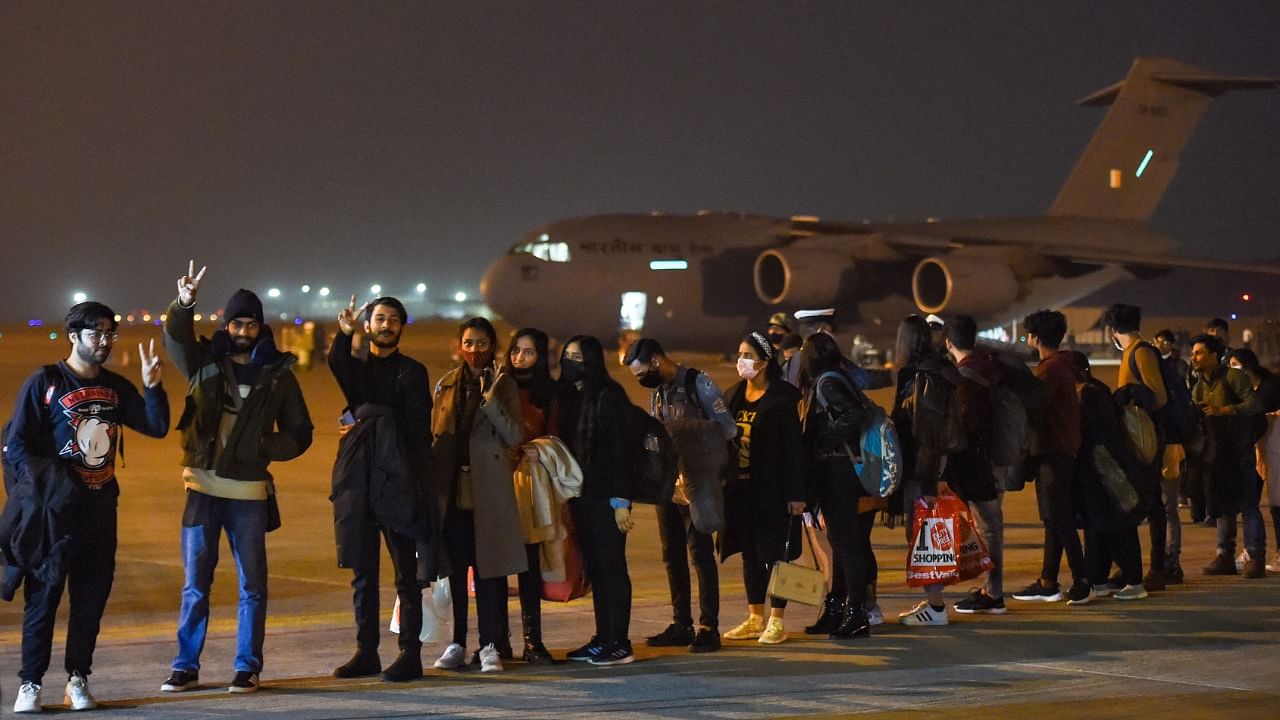 Indian nationals, evacuated from crisis-hit Ukraine, upon their arrival at the Hindon Air Force Station in Ghaziabad, early Thursday, March 3, 2022. Credit: PTI Photo