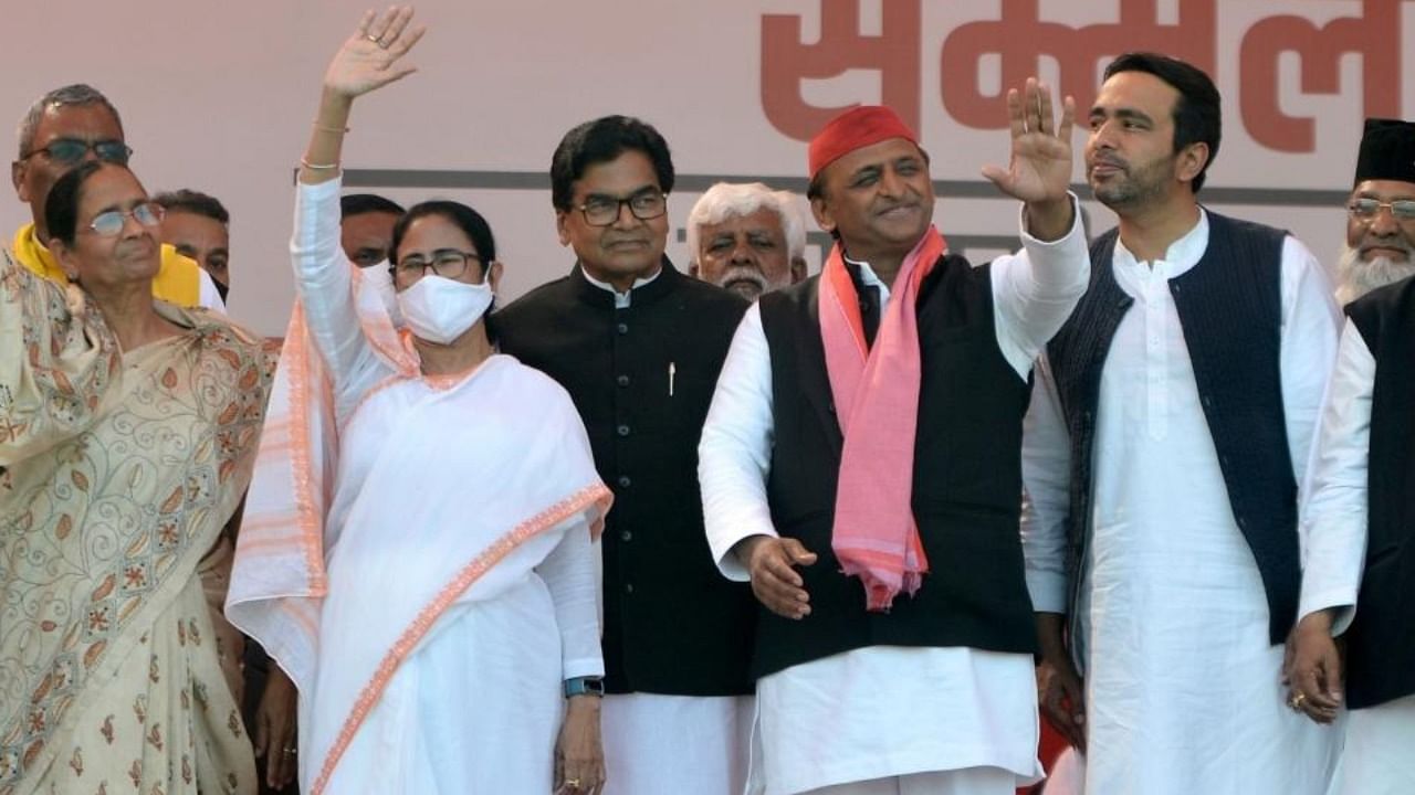 West Bengal Chief Minister Mamata Banerjee and Samajwadi Party President Akhilesh Yadav at a public meeting during the ongoing UP Assembly election in Varanasi on Thursday March 03,2022. Credit: IANS Photo