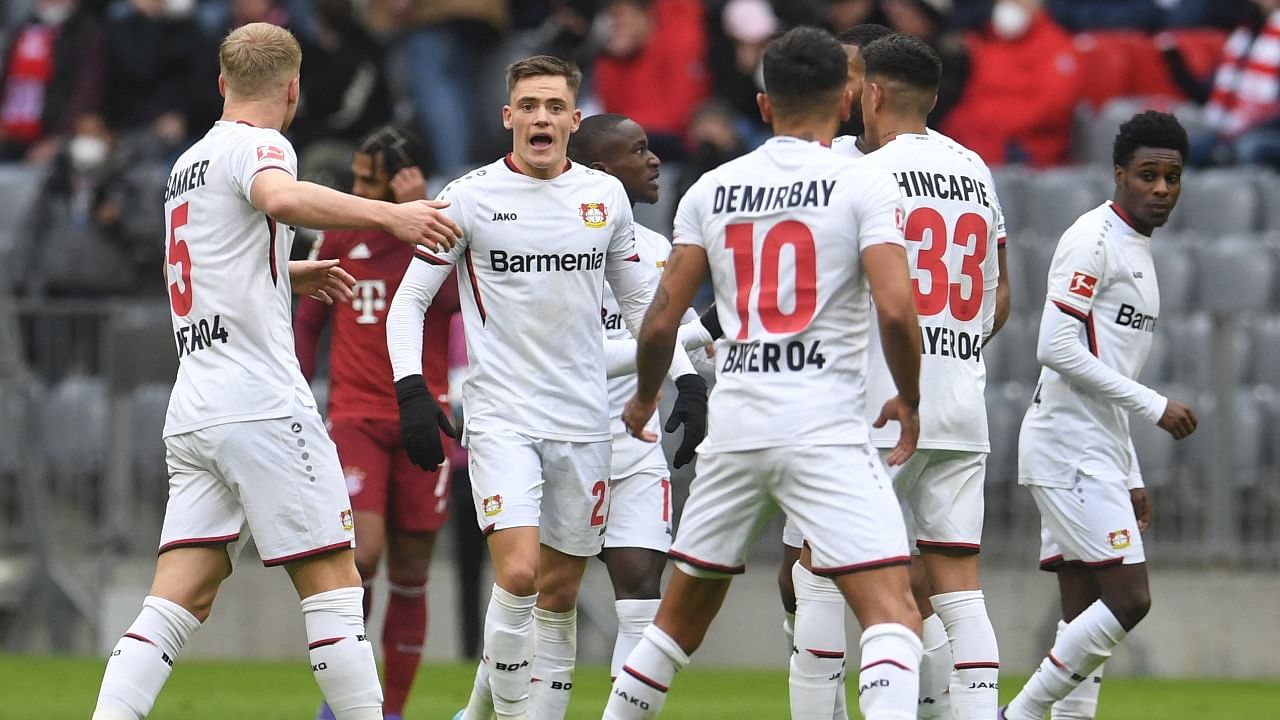 Bayer Leverkusen's Florian Wirtz, Kerem Demirbay, Piero Hincapie and Mitchel Bakker celebrate after Bayern Munich's Thomas Muller scores an own goal. Credit: Reuters Photo