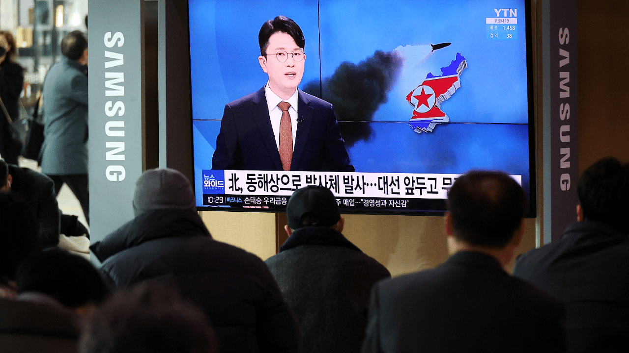 People watch a TV broadcasting a news report on North Korea's firing a ballistic missile off its east coast, in Seoul. Credit: Reuters Photo