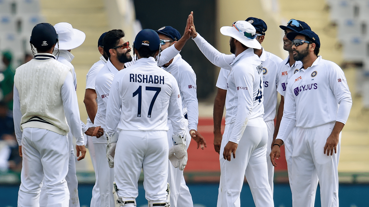 India’s Ravindra Jadeja celebrates with teammates the wicket of Sri Lanka's Suranga Lakmal during the 3rd day of the 1st cricket test match between India and Sri Lanka. Credit: PTI Photo