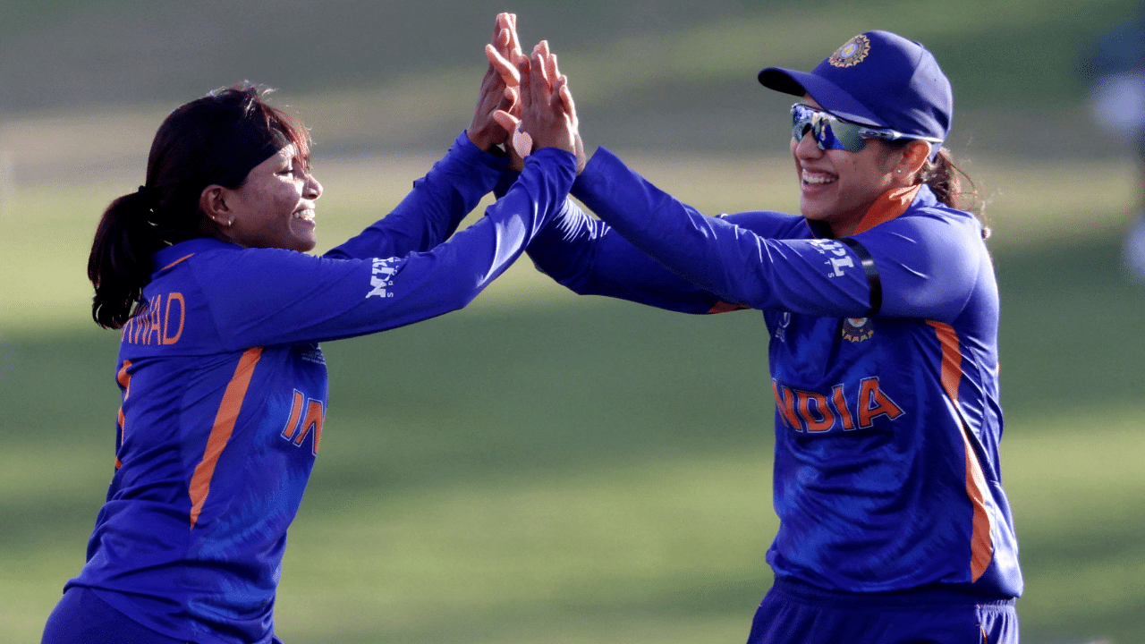 India’s Rajeshwari Gayakwad (L) celebrates with Smriti Mandhana the wicket of Pakistan’s Javeria Khan during the Round 1 Women's Cricket World cup match between India and Pakistan at Bay Oval. Credit: AFP Photo