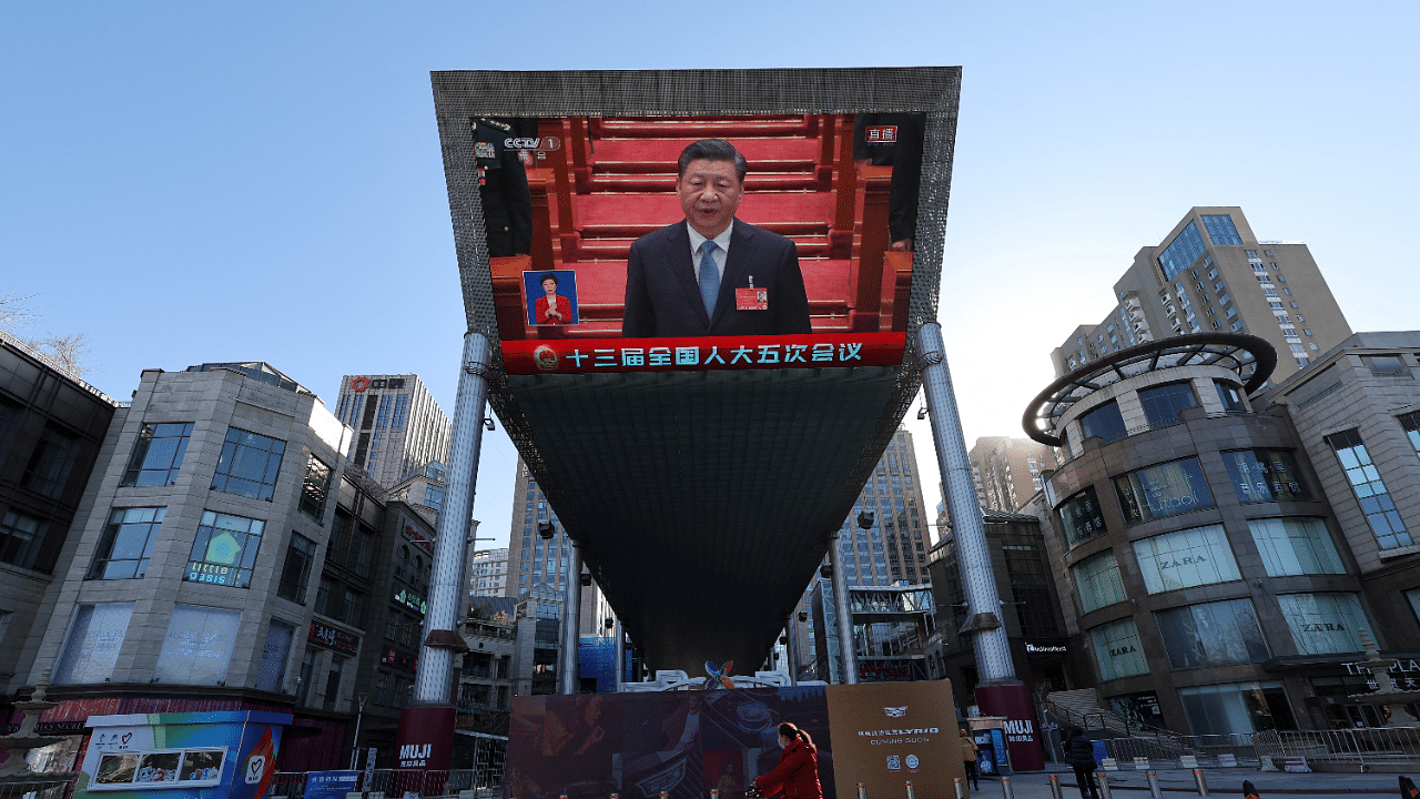 Giant screen shows Chinese President Xi Jinping attending the opening session of the National People's Congress (NPC) at the Great Hall of the People, in Beijing. Credit: Reuters Photo