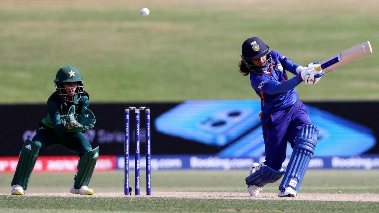 India's Mithali Raj (R) plays a shot as Pakisan’s wicketkeeper Sidra Nawaz looks on during Round 1 Women's Cricket World Cup match between India and Pakistan at Bay Oval in Tauranga on March 6, 2022. Credit: AFP Photo
