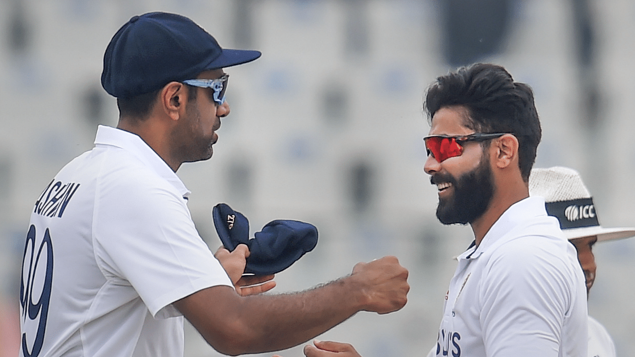 India’s Ravindra Jadeja with R Ashwin celebrates the wicket of Sri Lanka's Lahiru Kumara in their 1st inning, during the 3rd day of the 1st cricket test match between India and Sri Lanka. Credit: PTI Photo