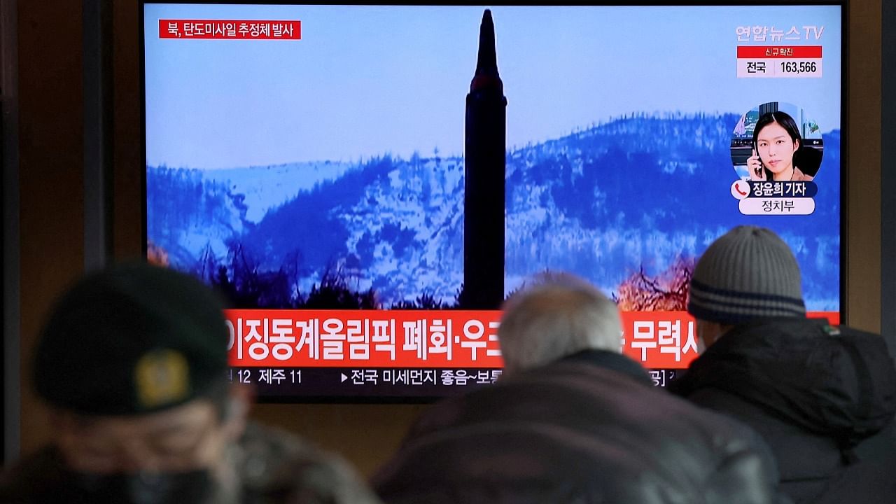 People watch a TV broadcasting file footage of a news report on North Korea firing what appeared to be a ballistic missile, in Seoul, South Korea, February 27, 2022. Credit: Yonhap via Reuters