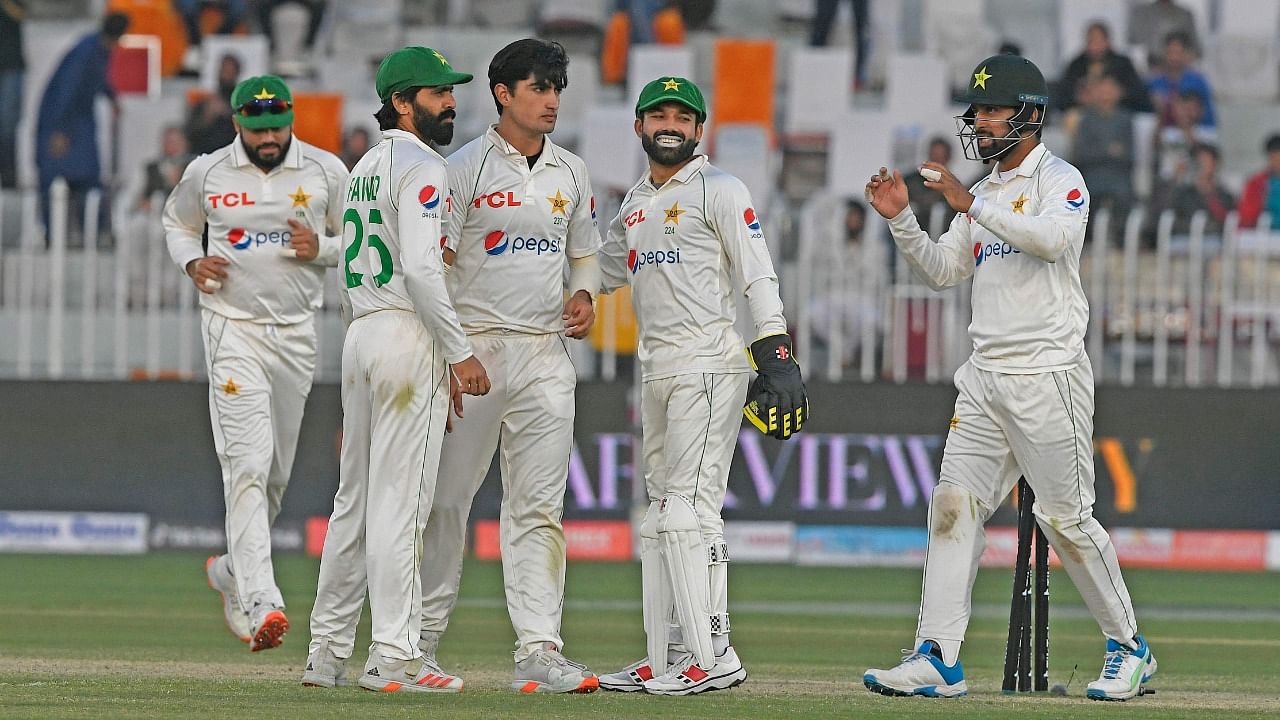 Pakistan's Naseem Shah (C) celebrates with teammates after taking the wiket of Australia's Alex Carey (not pictured) during the fourth day play of the first Test cricket match between Pakistan and Australia at the Rawalpindi Cricket Stadium. Credit: AFP Photo