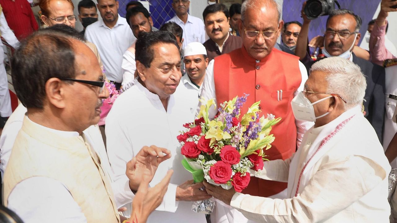 Madhya Pradesh Chief Minister Shivraj Singh Chouhan with Speaker of Madhya Pradesh State Assembly Girish Gautam and Leader of Opposition Kamal Nath welcome Governor Mangubhai C Patel. Credit: PTI Photo