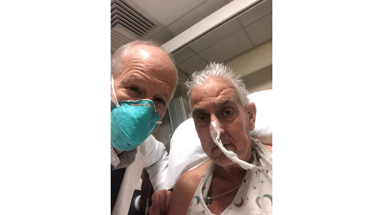 Surgeon Dr. Bartley Griffith (L) with patient David Bennett, Sr., who received a heart implant from a genetically modified pig, in Baltimore, Maryland. Credit: AFP Photo