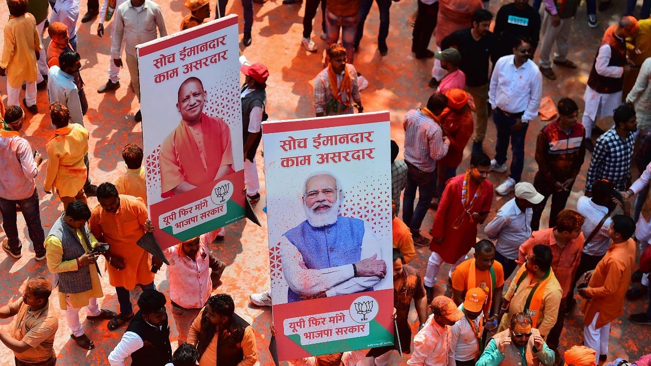 BJP supporters celebrate outside the party office in Lucknow. Credit: AFP Photo