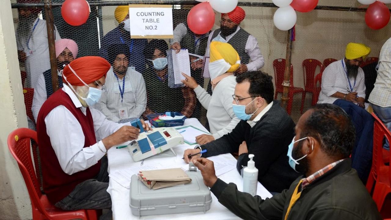 Election staff during counting day of Punjab Assembly elections, at a counting centre in Amritsar district, Thursday, March 10, 2022. Credit: PTI Photo