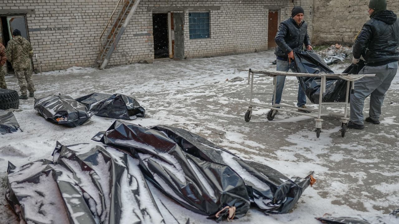 In the courtyard of the forensic institute where the morgue is located, the snow is constantly falling on corpses wrapped in grey plastic body bags, waiting to be evacuated. Credit: AFP Photo
