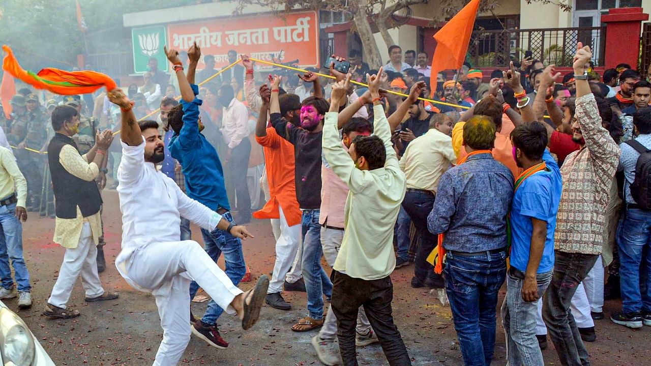 BJP supporters celebrate party's victory in the recent Assembly Polls, at Jharkhand BJP state headquarters, in Ranchi. Credit: PTI Photo