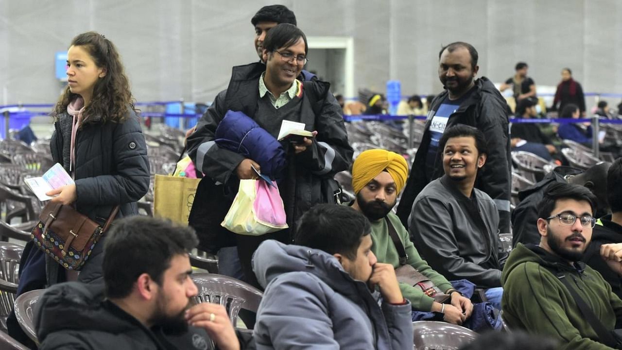Indian and foreign nationals, evacuated from war-torn Ukraine, upon their arrival at the Air Force Station, Hindan in Ghaziabad. Credit: PTI Photo