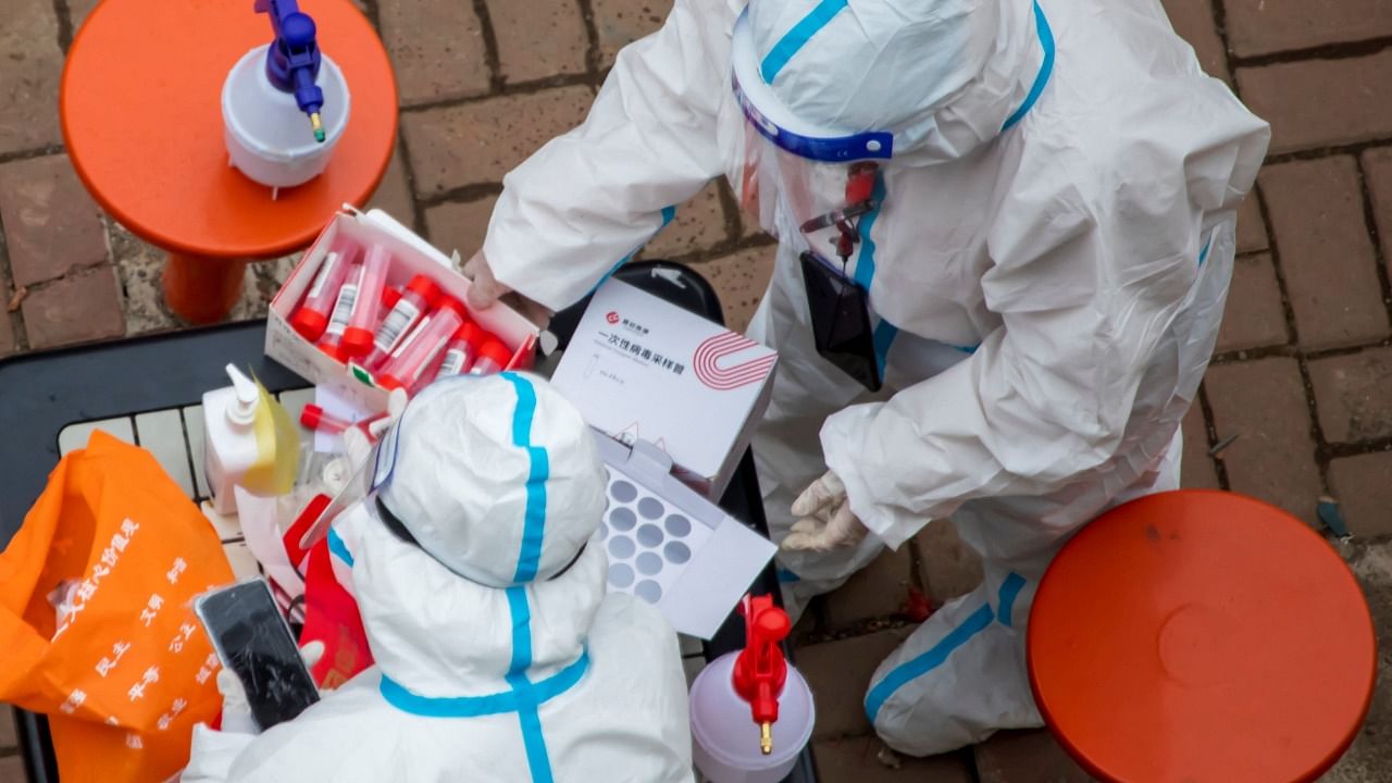 Medical workers prepare to conduct nucleic acid tests for the Covid-19 coronavirus for residents in Jilin in China's northeastern Jilin province. Credit: AFP Photo