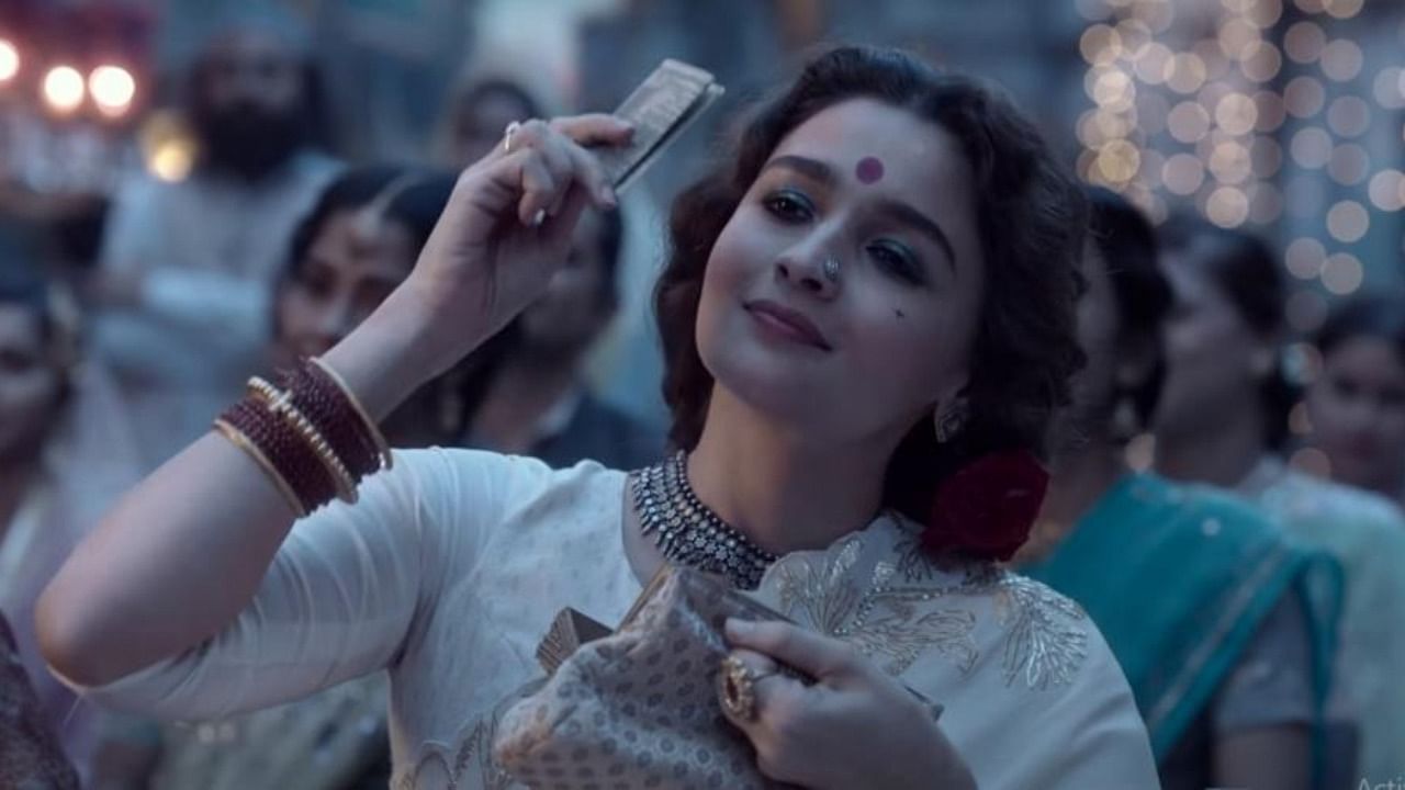 In the film, Alia Bhatt plays Gangubai, a brothel owner and a mafia woman, who is seen in lavish outfits and surrounded by wealthy men