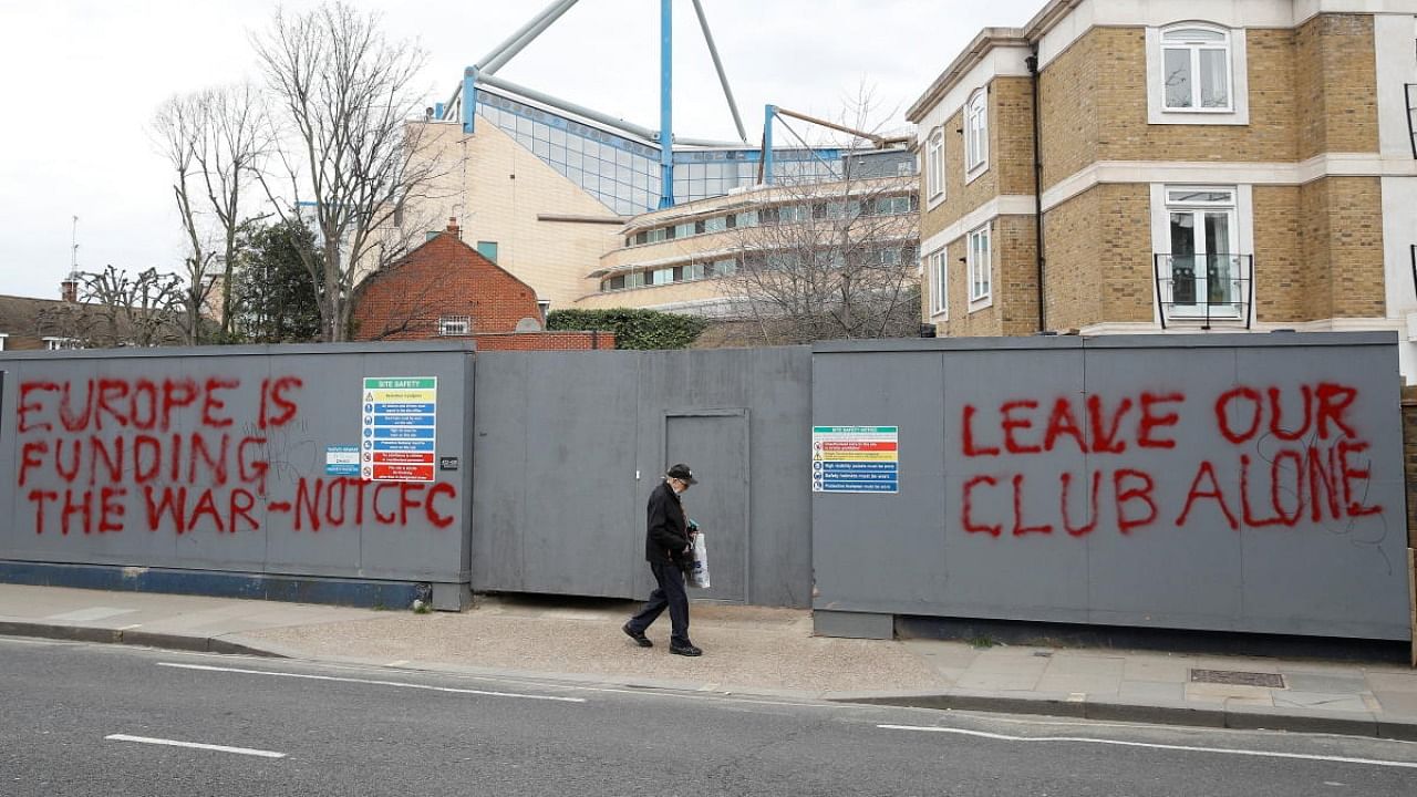 Graffiti written on hoardings next to the Chelsea Football Club's stadium, Stamford Bridge, following Britain's imposing of sanctions on the club's Russian owner, Roman Abramovich. Credit: Reuters Photo