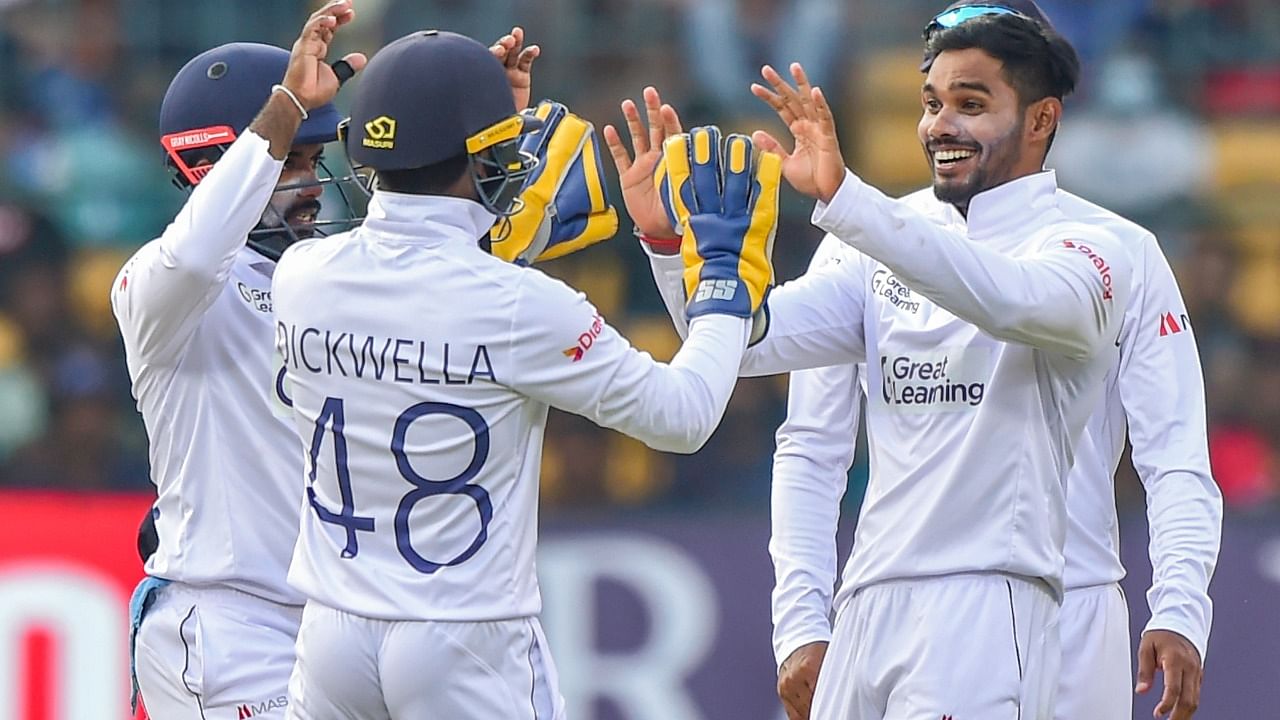 Sri Lanka's Dhananjaya De Silva with teammates celebrate the wicket of India's batter R Ashwin during the first day of 2nd test cricket match between India and Sri Lanka at Chinnaswamy Stadium, in Bengaluru. Credit: PTI Photo