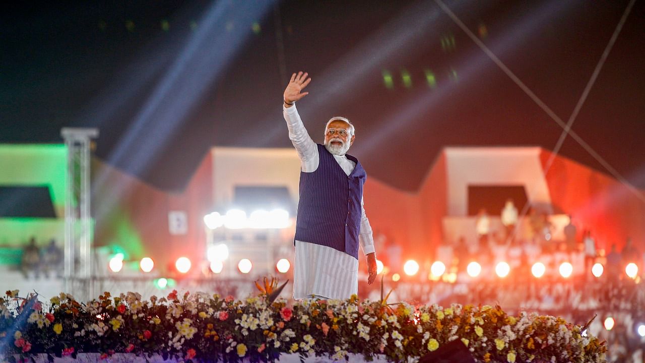 Prime Minister Narendra Modi waves towards supporters during the inaugural ceremony of the 11th Khel Mahakumbh, at Sardar Patel stadium in Ahmedabad, Saturday. Credit: PTI Photo