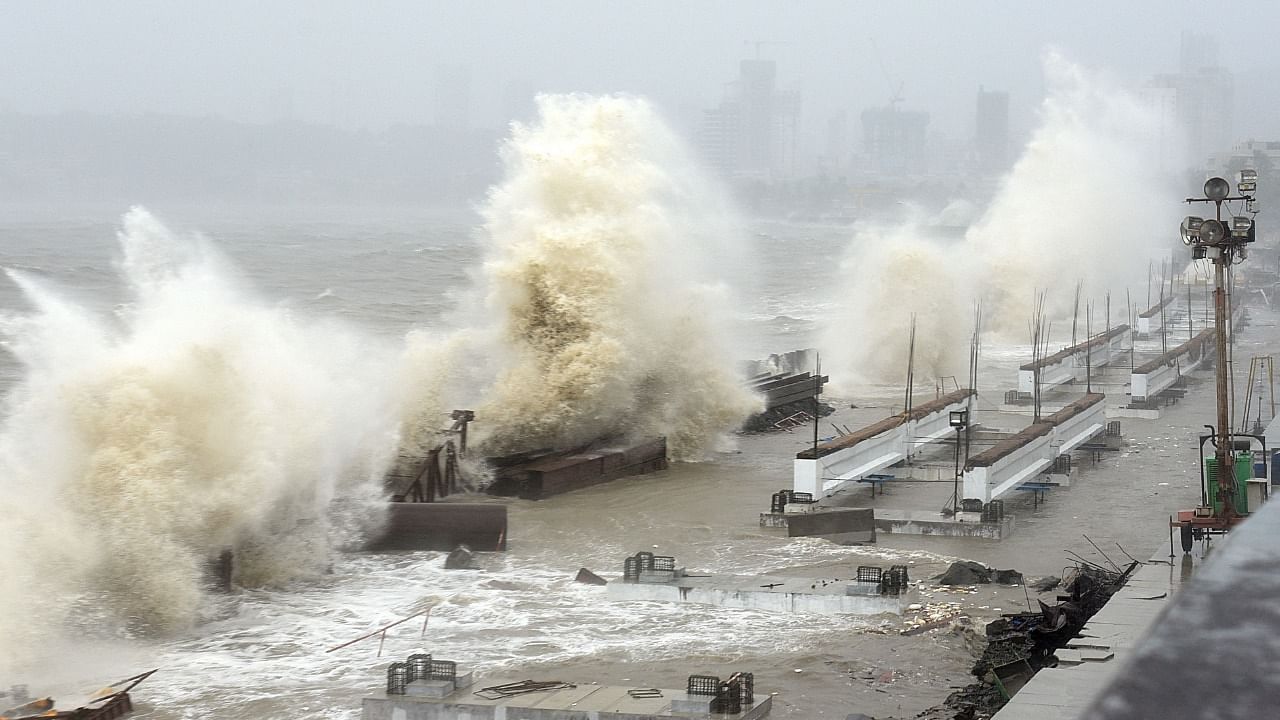  Waves lash over onto a shoreline in Mumbai on May 17, 2021, during Cyclone Tauktae. Credit: AFP File Photo