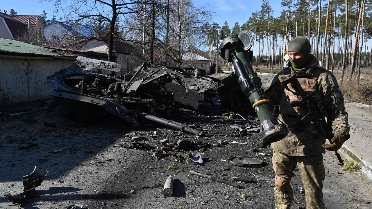 A Ukrainian soldier holds a Next Generation Light Anti-tank Weapon (NLAW) that was used to destroy a Russian armoured personal carrier (APC) in Irpin. Credit: AFP Photo