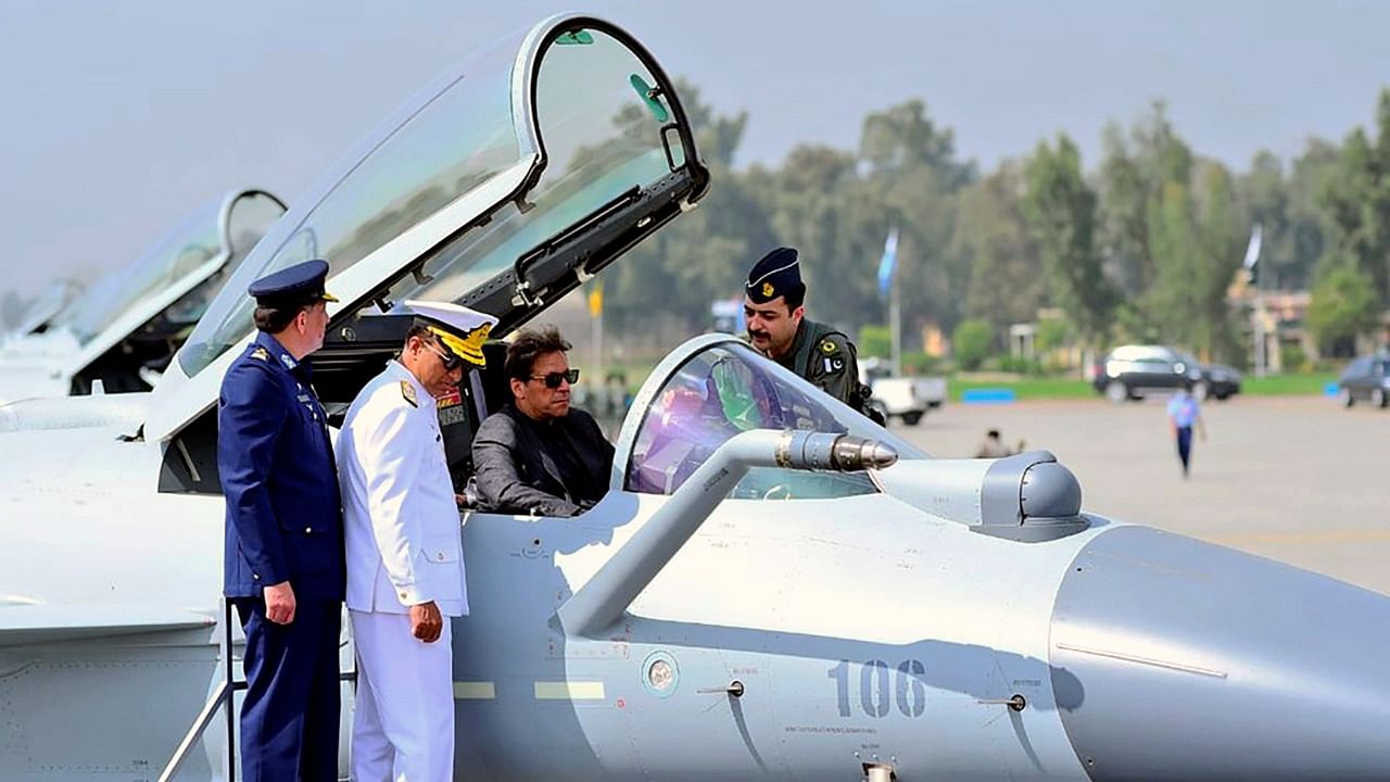 A Pakistan Air Force official briefs Prime Minister Imran Khan, center in cockpit, about Chinese-built J-10C fighter jet during a ceremony in Minhas Base near Islamabad, Pakistan. Credit: AP Photo