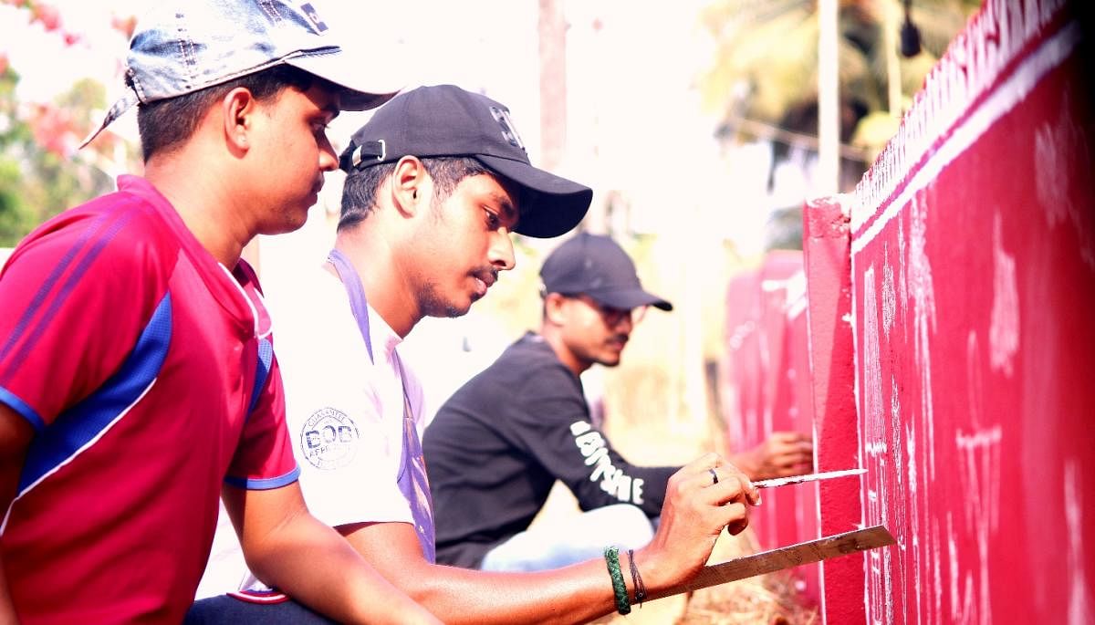 Students of Nitte Dr Shankar Adyanthaya Memorial First Grade College paint the walls of Government Higher Primary School at Nandalike with warli art.