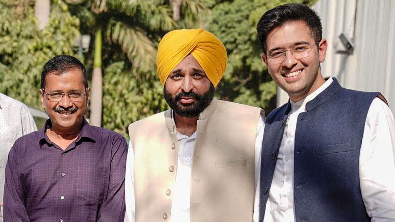 AAP's Punjab Chief Minister-elect Bhagwant Mann with Delhi CM and party convenor Arvind Kejriwal and party leader Raghav Chadha in New Delhi, Friday, March 11, 2022.  Credit: PTI Photo