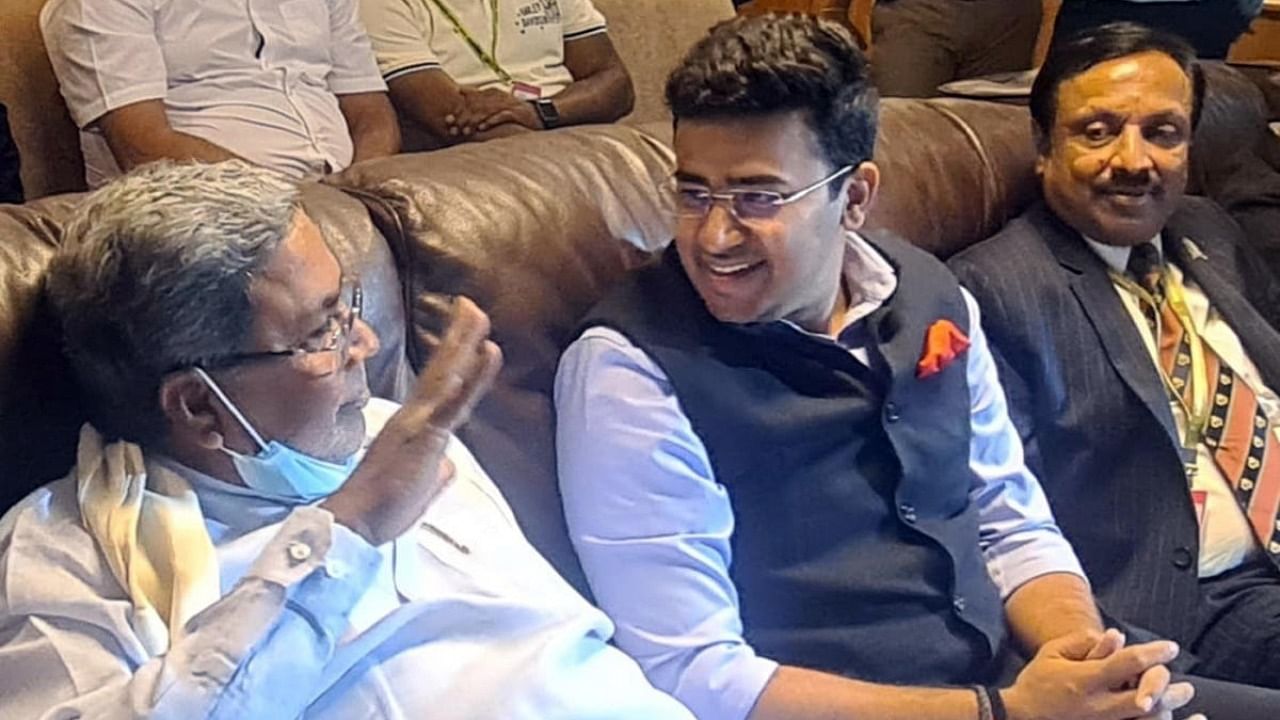 Leader of Opposition Siddaramaiah and Bangalore South MP Tejasvi Surya share a word during the India-Sri Lanka Test match at Chinnaswamy stadium in Bengaluru on Sunday. Credit: Special arrangement