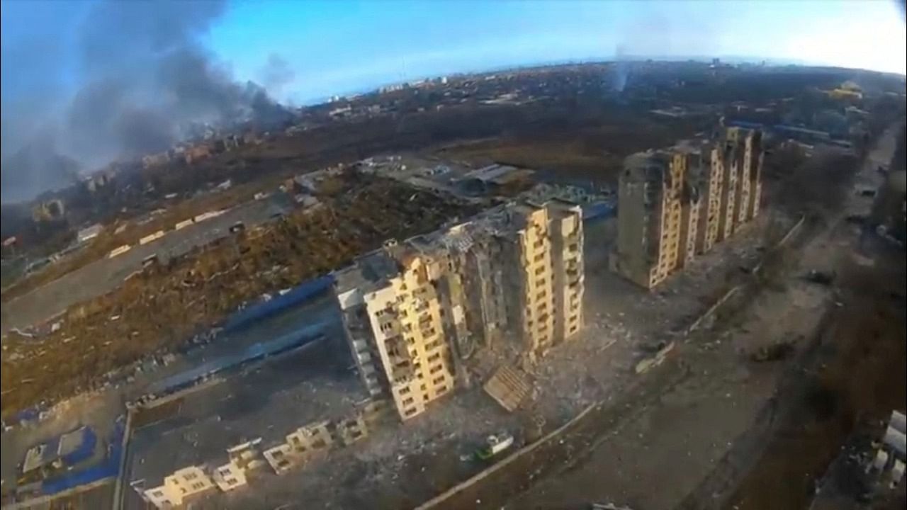 An aerial view shows damaged residential buildings, amid Russia's invasion of Ukraine, in Mariupol, Ukraine March 14, 2022 in this still image taken from a drone footage obtained from social media. Credit: Azov regiment press service/via Reuters