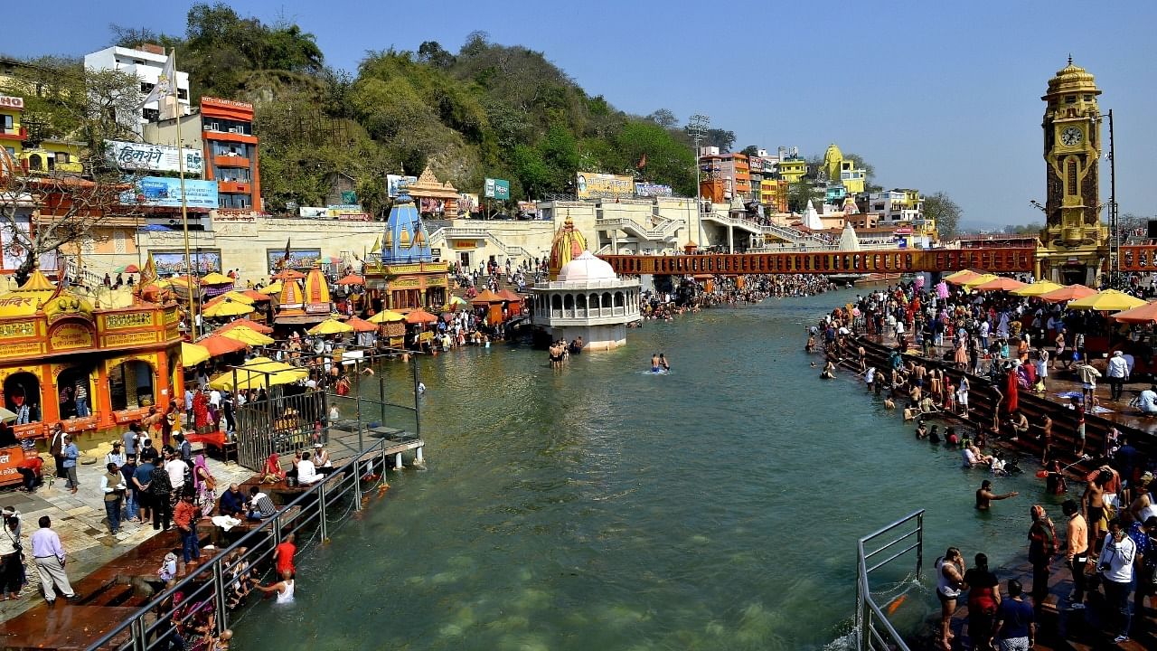 Devotees take a holy dip in the river Ganga at Har Ki Pauri in Haridwar on March 14, 2022. Credit: IANS File Photo