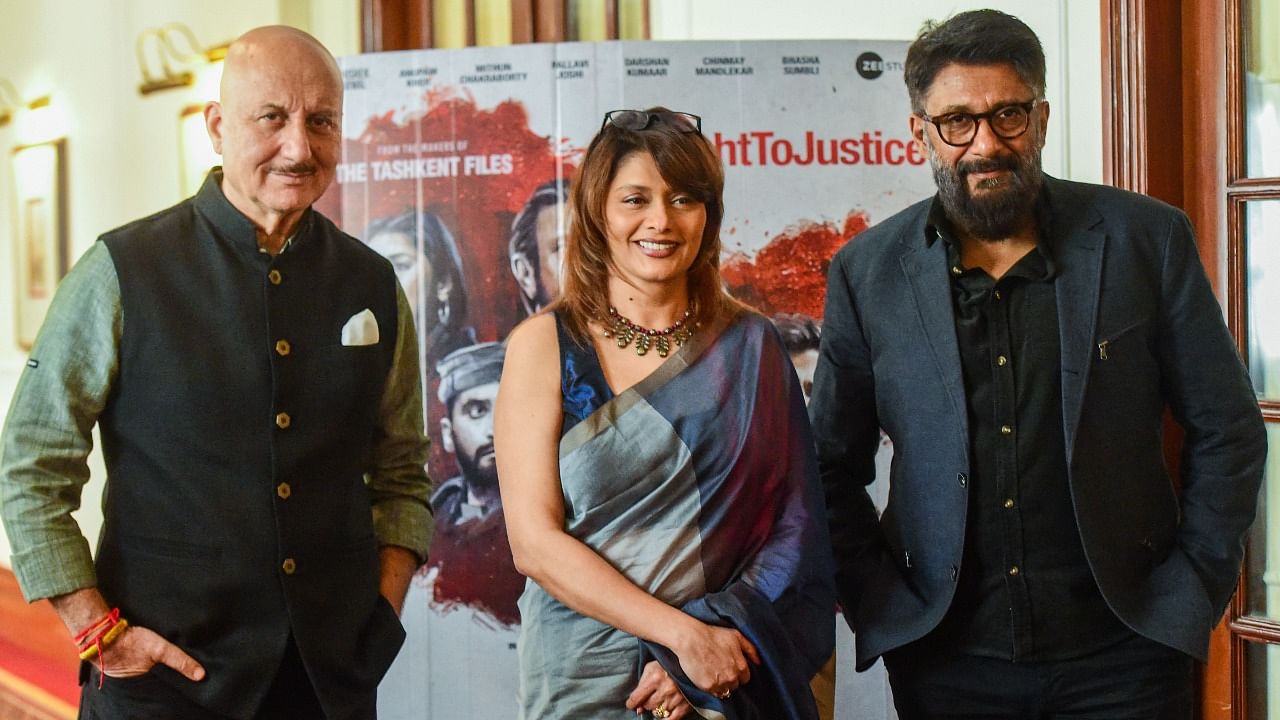 (L-R) Actors Anupam Kher and Pallavi Joshi with the director of the film, Vivek Agnihotri. Credit: PTI Photo