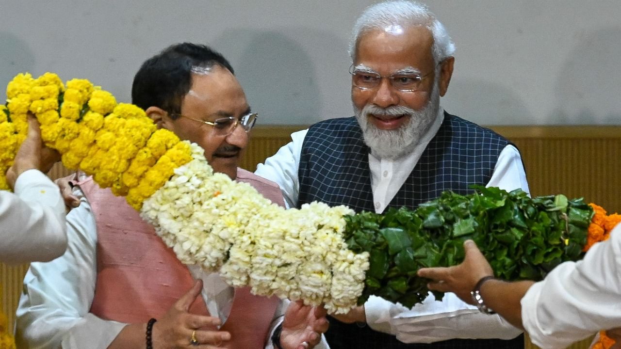 PM Modi and BJP chief JP Nadda at the meeting. Credit: AFP Photo