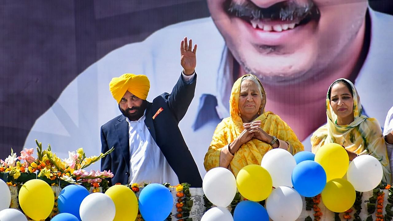 Bhagwant Mann waves at supporters during a rally after his victory in Dhuri. Credit: PTI File Photo