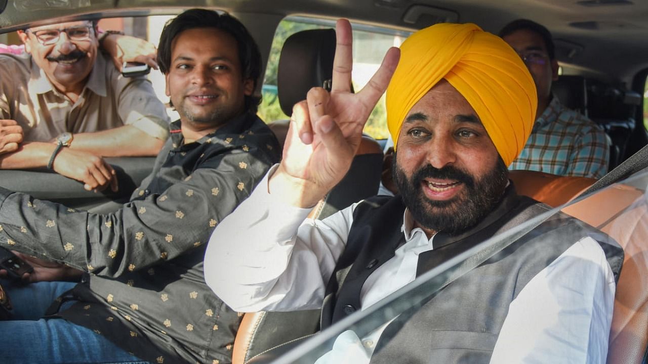 AAP leader and Punjab CM-designate Bhagwant Mann flashes victory sign after submitting his resignation as a member of Parliament, during the second part of Budget Session, at Parliament House, in New Delhi, Monday, March 14, 2022. Credit: PTI Photo