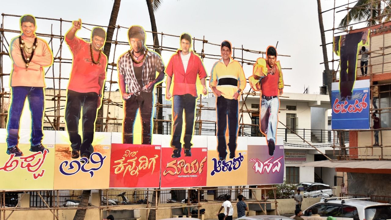 Puneeth’s banners and huge cutouts have come up in most theatres. Credit: DH Photo/Anup Ragh T