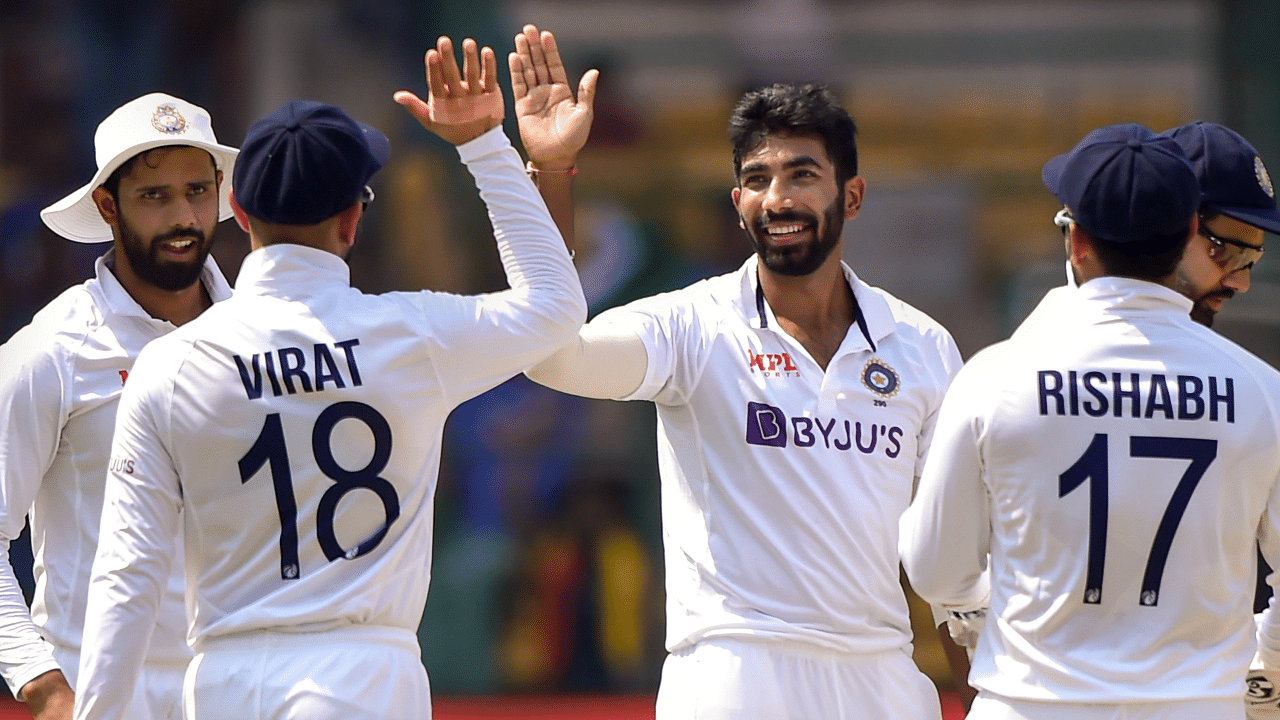  Jasprit Bumrah celebrates with teammates after the wicket of Sri Lanka's batsman Niroshan Dickwella, during the second day of the second test cricket match between India and Sri Lanka. Credit: PTI Photo
