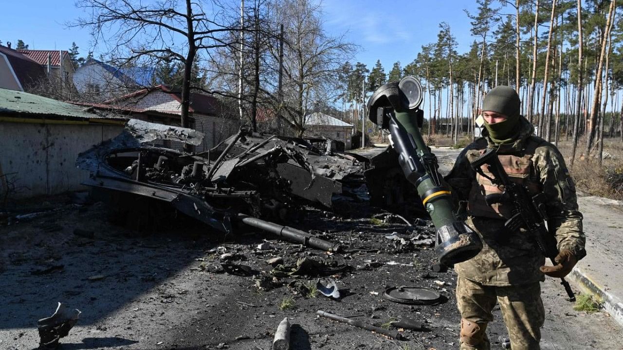 A Ukrainian soldier holds a Next Generation Light Anti-tank Weapon (NLAW) that was used to destroy a Russian armoured personal carrier (APC) in Irpin, north of Kyiv. Credit: AFP Photo