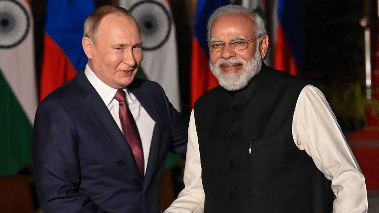 Prime Minister Narendra Modi greets Russian President Vladimir Putin. Credit: AFP Photo