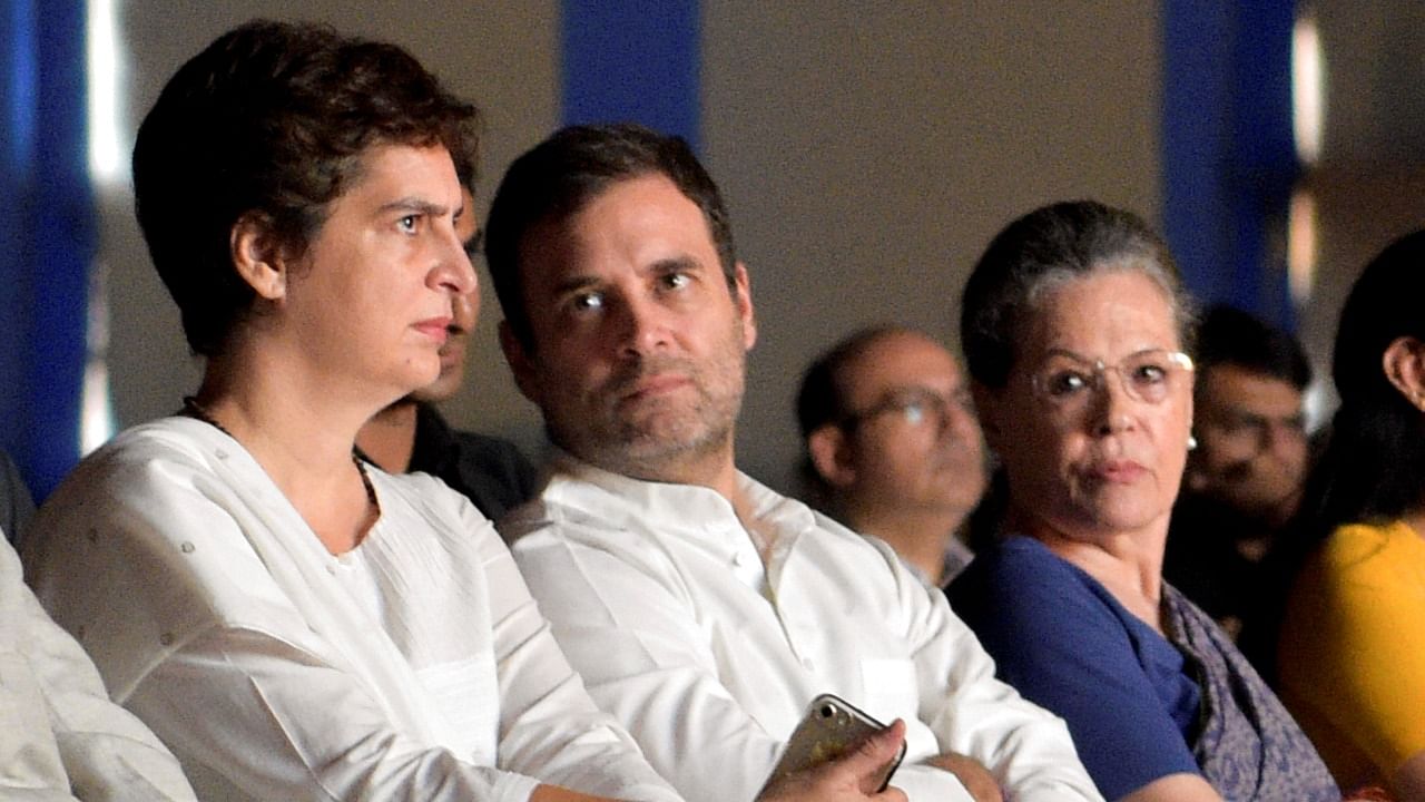 A file photo of Congress leaders Priyanka (L) and Rahul Gandhi (C) alongside Sonia Gandhi at an event. Credit: PTI Photo